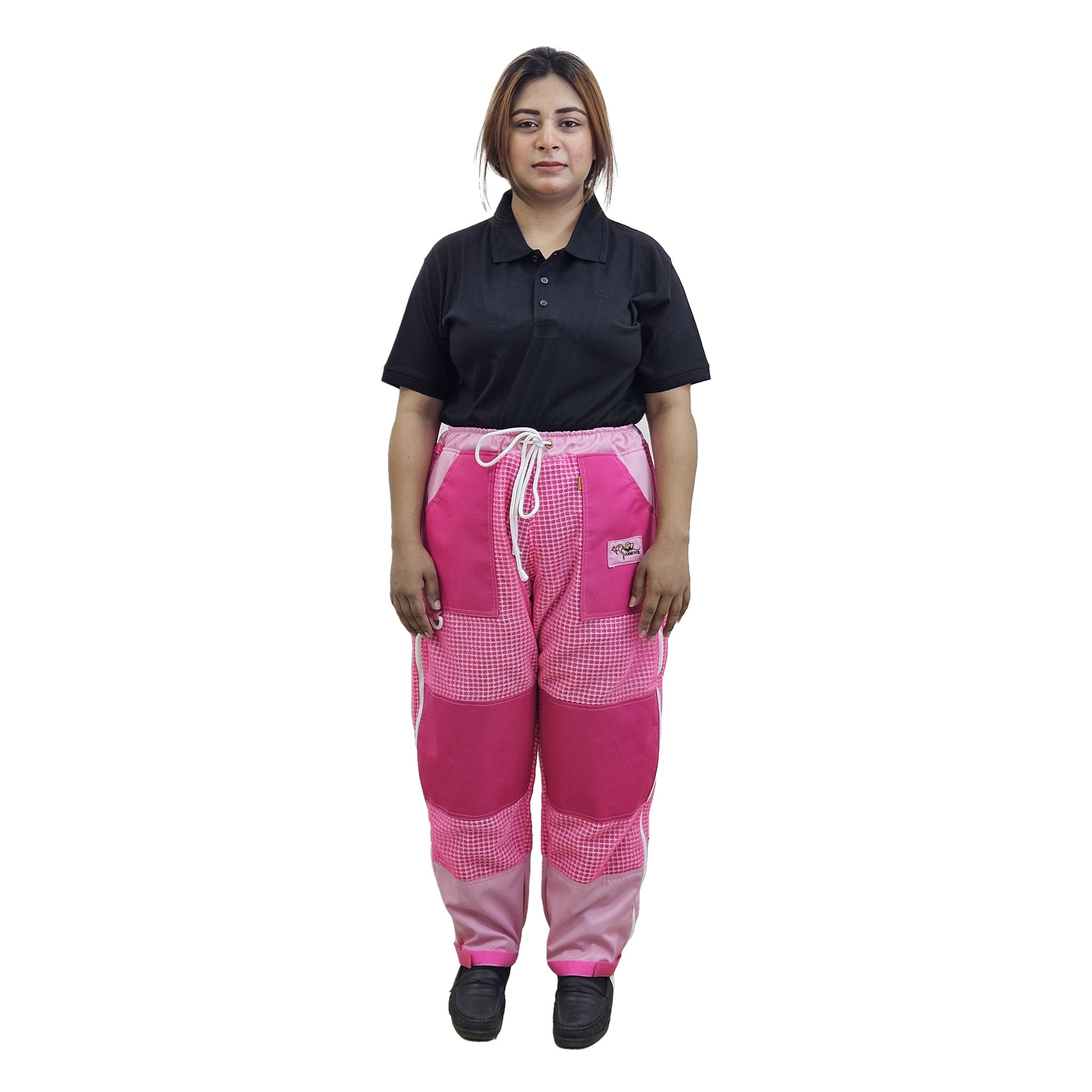 Woman wearing a black shirt and pink checkered pants