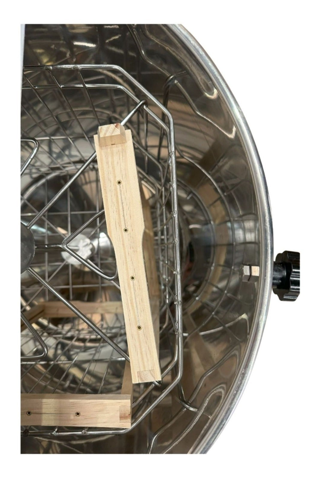 OZ Armour manual honey extractor interior with stainless steel basket and wooden frame supports