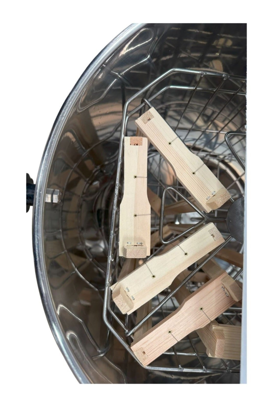 Top view of OZ Armour manual honey extractor interior with wooden frame supports