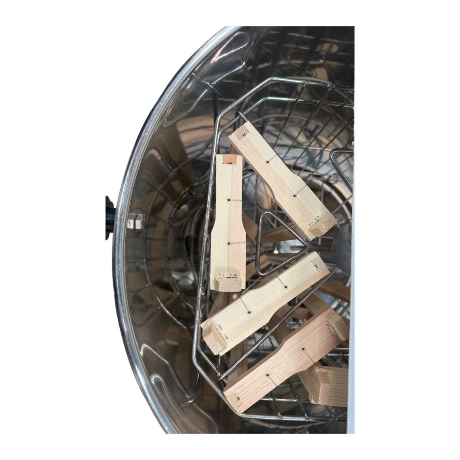 Top view of OZ Armour manual honey extractor interior with wooden frame supports