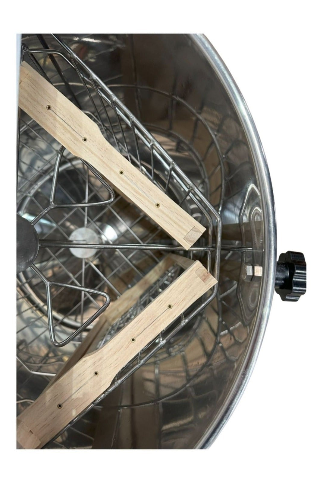 OZ Armour manual honey extractor interior showing stainless steel basket and wooden frame rests