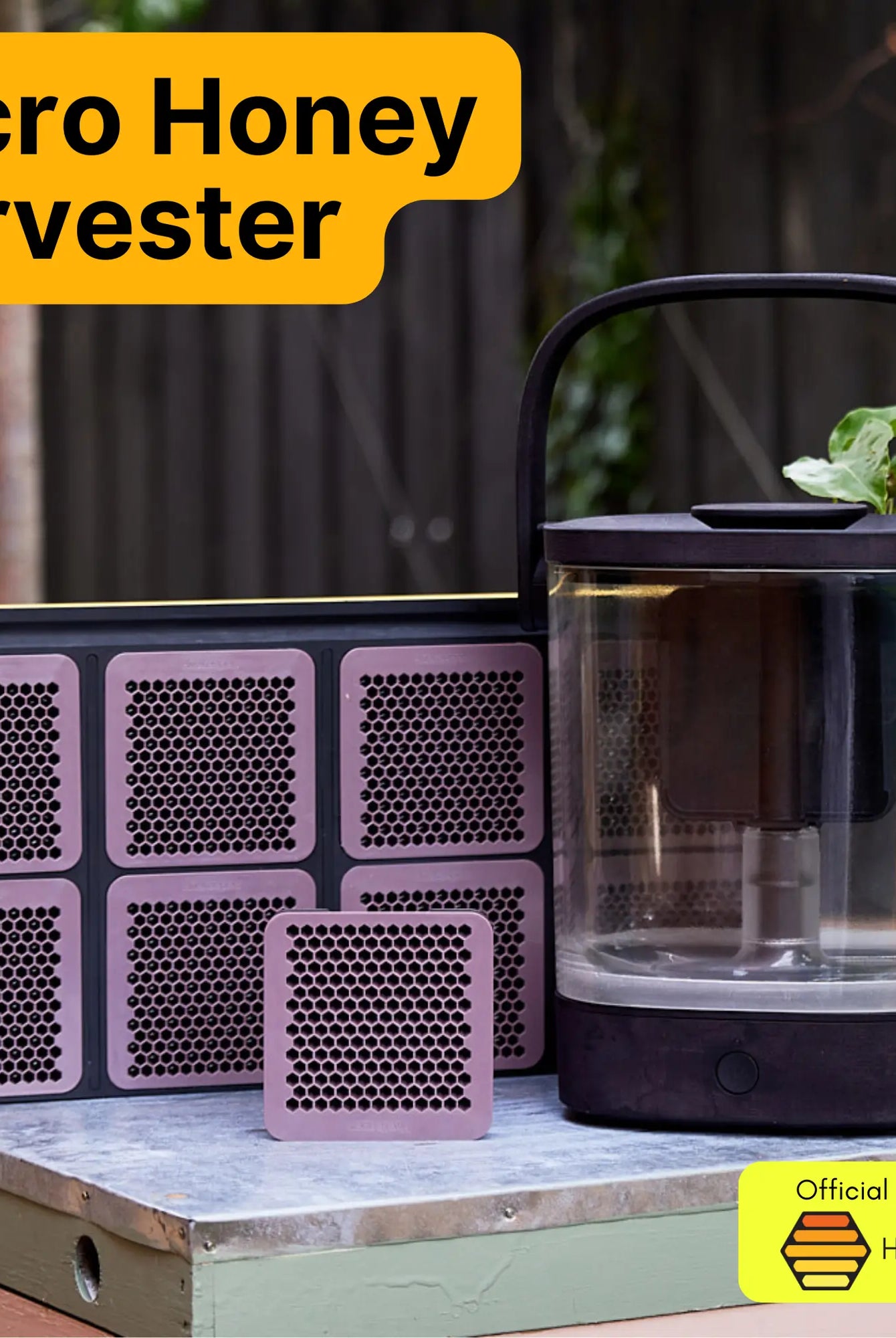 Micro Honey Harvester displayed outdoors on a hive box alongside six honeycomb cassettes