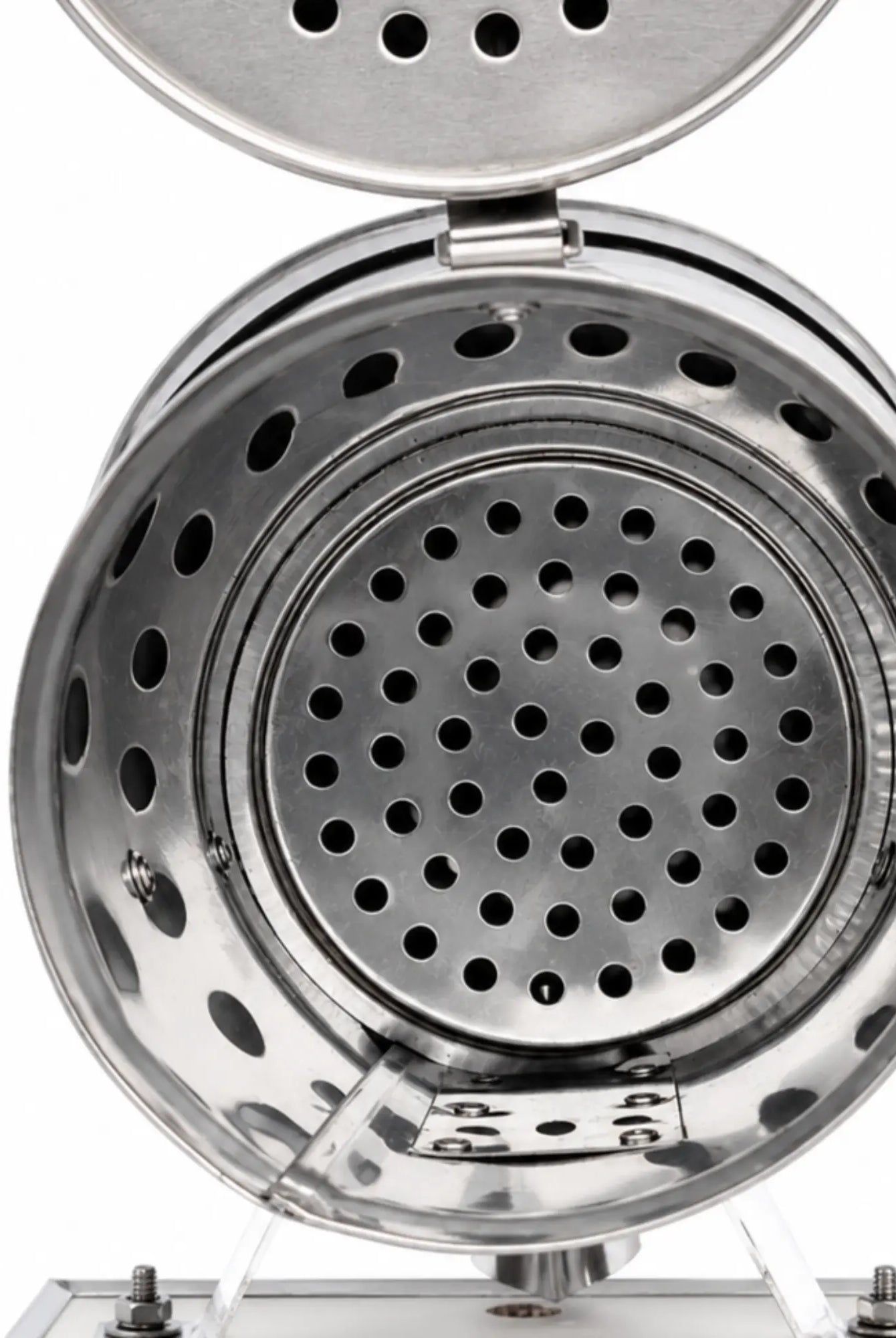 Inside view of OZ Armour stainless steel bee smoker showing perforated fire chamber and grate