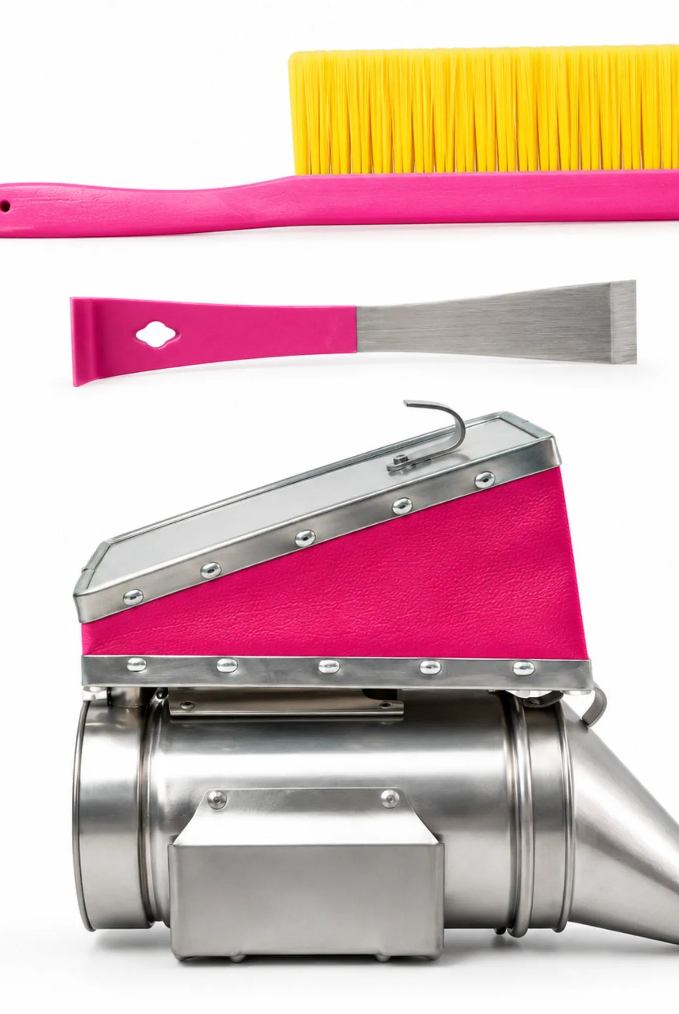 Set of cleaning tools including a pink brush, scraper, and a larger cleaning device on a white background.