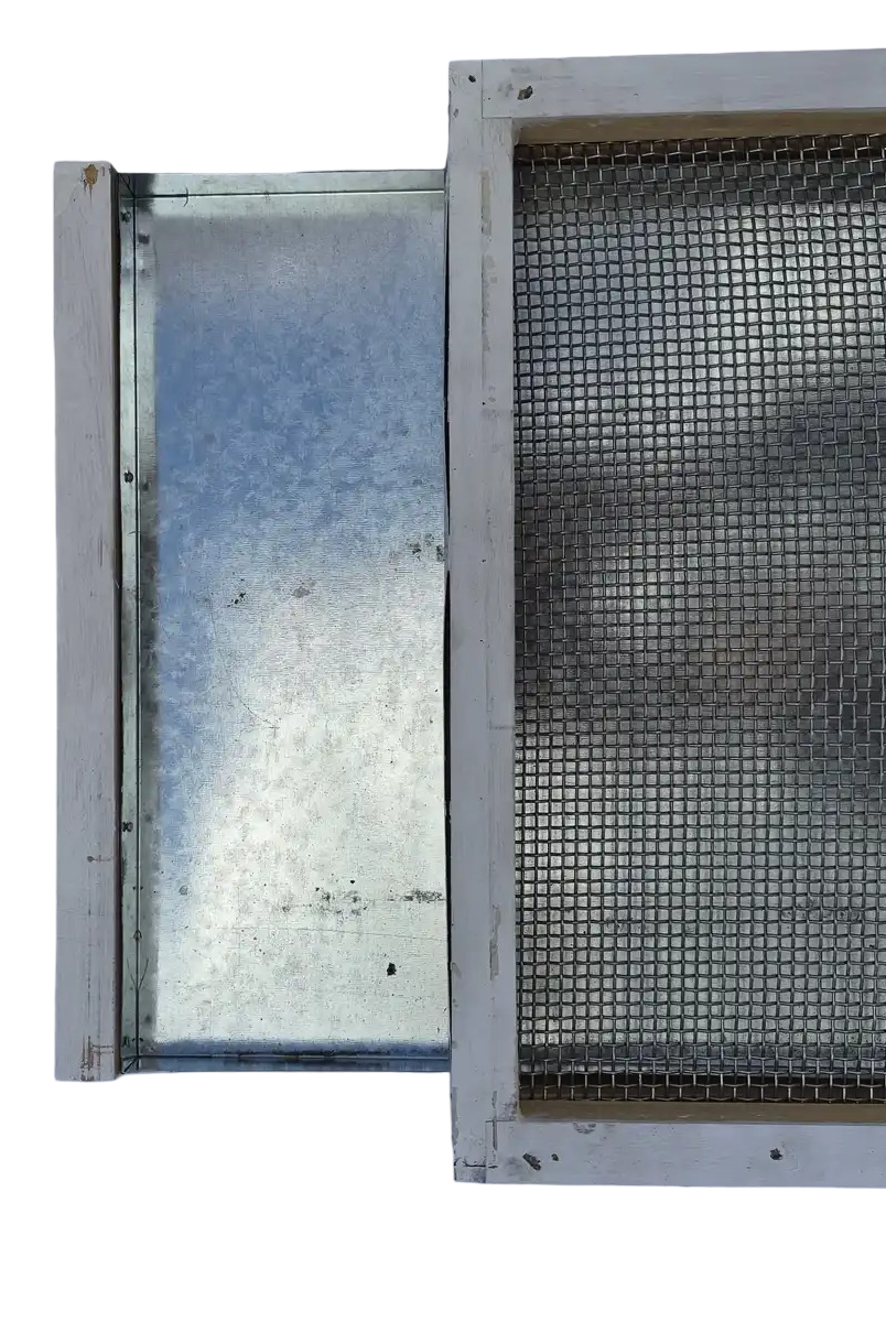 Screened bottom board with galvanized varroa mite monitoring tray partially pulled out