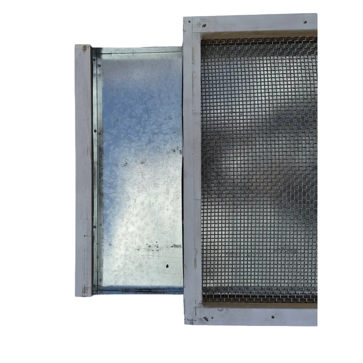 Screened bottom board with galvanized varroa mite monitoring tray partially pulled out