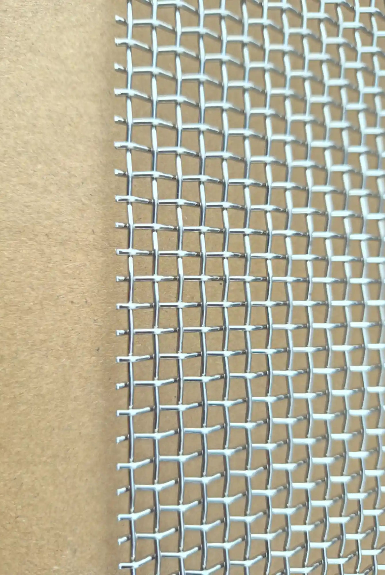 Close-up of stainless steel mesh weave for hive ventilation and beetle control