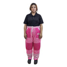 Woman wearing a black shirt and pink checkered pants