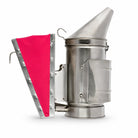 OZ Armour pink bellows bee smoker in stainless steel with heat guard, side view